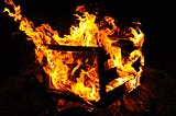 A wooden crate on fire.