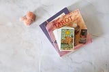Tarot card deck with a spiritual guide and crystals