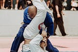 two jiu-jitsu competitors battling for an armbar