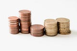 Five stacks of gold coins