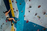 a woman bouldering