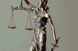 The criminal justice system represented by Lady Justice.