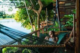 Woman on hammock at eco-lodge on Lake Nicaragua