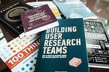 Picture of ux research books pile on a table.