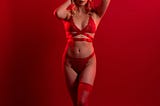 Sexy blonde woman in red lingerie
