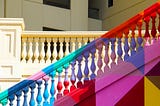 Photo of a colorfully painted staircase by Nick Fewings on Unsplash