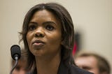 Candace Owens speaking into a microphone.