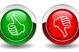 Green circle with thumbs up next to a red circle with a thumbs down