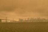 Smoke from California wildfires cast an orange hue over San Francisco and the Bay Bridge