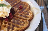waffle on a plate with fruit