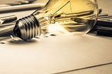 Light bulb with writing tools