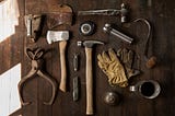 Various tools displayed on a wooden table.