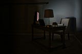 Dark room illuminated by computer screen