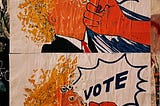 A poster pasted on a wall. It has a cartoon fist punching a caracature of Donald Trump with the word “VOTE” in large letters over it.