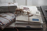 Pile of letters binded on a wooden desk