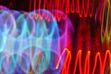 Abstracted neon light in yellow, blue, red, and purple