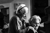 Black and white photo of two elderly women friends.