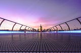 Millenium Bridge in London, facing St. Paul’s Cathedral at sundown.