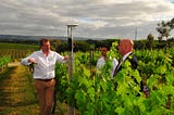 Three men in a vineyard with the Arable Mark 2