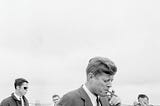 President John F. Kennedy smoking a cigar in Hyannis Port, Massachusetts