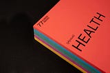 Front cover of an orange book with the word ‘Health’ on the cover