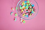 A bowl of Lucky Stars against a pink background