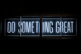 Black background with white text reading “Do Something Great”