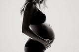 Picture of a pregnant woman holding her belly