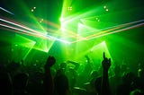 Green lights and crowds of techno party aka rave