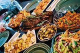 Comfort foods from different cultures on a dining table