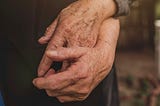 an older couple holding hands