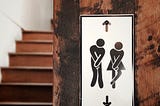 Male and female illustrations, indicating they need to use the bathroom
