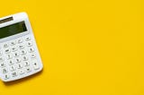 Calculator on yellow background