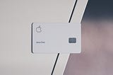 An apple cerdit card on a desk