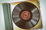 pic of a Victrola vinyl record with the label of “Summer Moon” — being the music contained therein