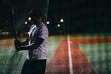 Baseball player coming up to bat.