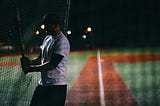 Baseball player coming up to bat.