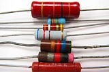 Resistors in a stack. Our blog answers the question “do resistors have polarity?”