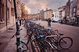 A city street in Oxford, England, showing bicycles, and pedestrians-a view representative of life as a traveler without an iPhone.