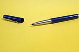 Pen and cap on a surface