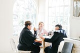 Three friends talking and laughing