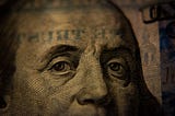 Benjamin Franklin’s face on the $100 bill gazes at you representing how to make money in affiliate marketing