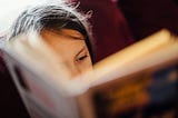 Young girl reading book