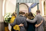 Stock photo of mourners at a funeral