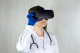 A girl in a doctor’s coat with VR glasses.