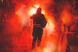 Man surrounded by smoke and fireworks on Chinese New Year