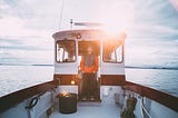A guy onboard with novice look. He waits for action.