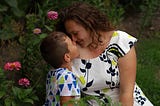 mother and son in a garden