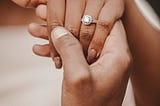 Engagement ring on african american hand