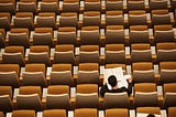 Student studying in a lecture hall — Photo by <a href=”https://unsplash.com/@flipboo?utm_source=unsplash&utm_medium=referral&utm_content=creditCopyText">Philippe Bout</a> on <a href=”/s/photos/study?utm_source=unsplash&utm_medium=referral&utm_content=creditCopyText”>Unsplash</a>